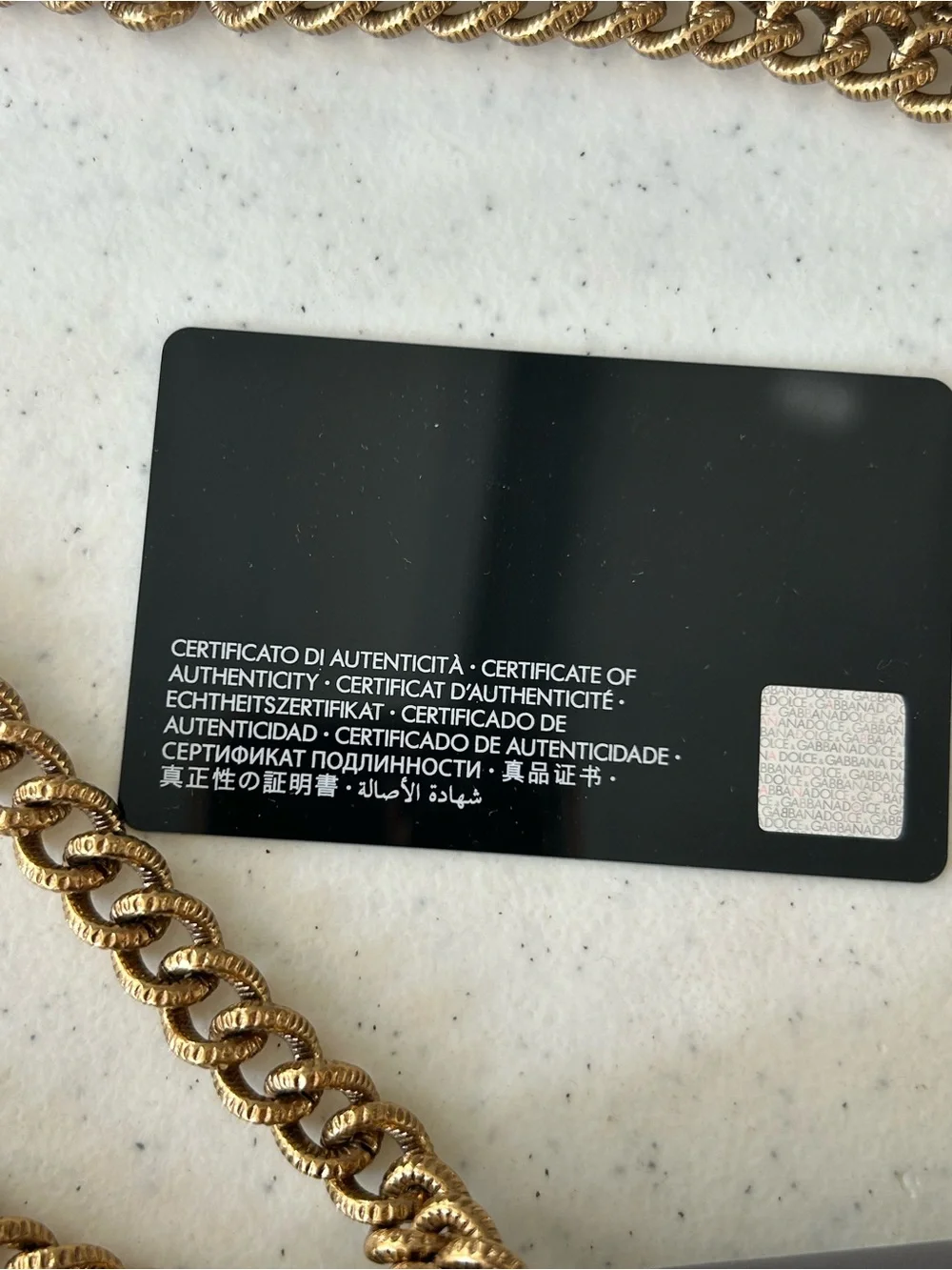 Dolce & Gabbana Gray Leather Shoulder Bag with Gold Heart Emblem.